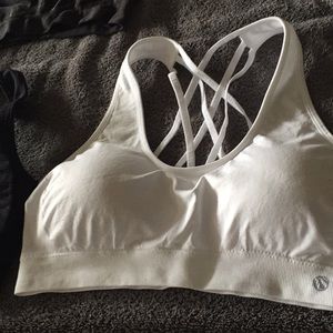 All 4 sports bras 2 white 2 black.   Fit 38C cup.